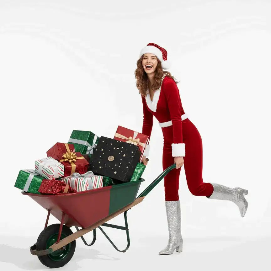 AEMBR holiday image: smiling woman in Santa outfit pushing wheelbarrow full of wrapped gifts.