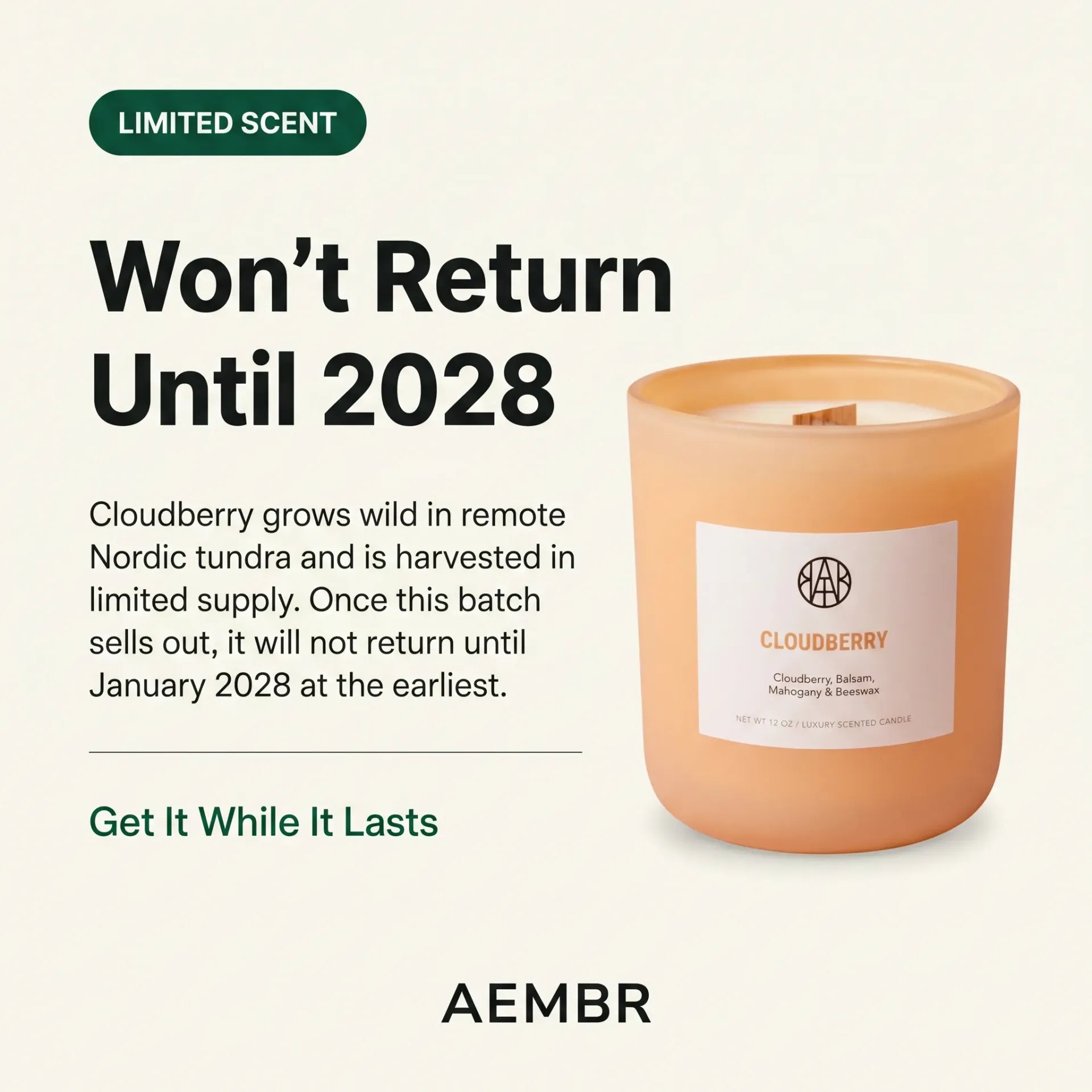 AEMBR Cloudberry Candle with a glass jar and lit wick, emitting a warm, cozy glow.
