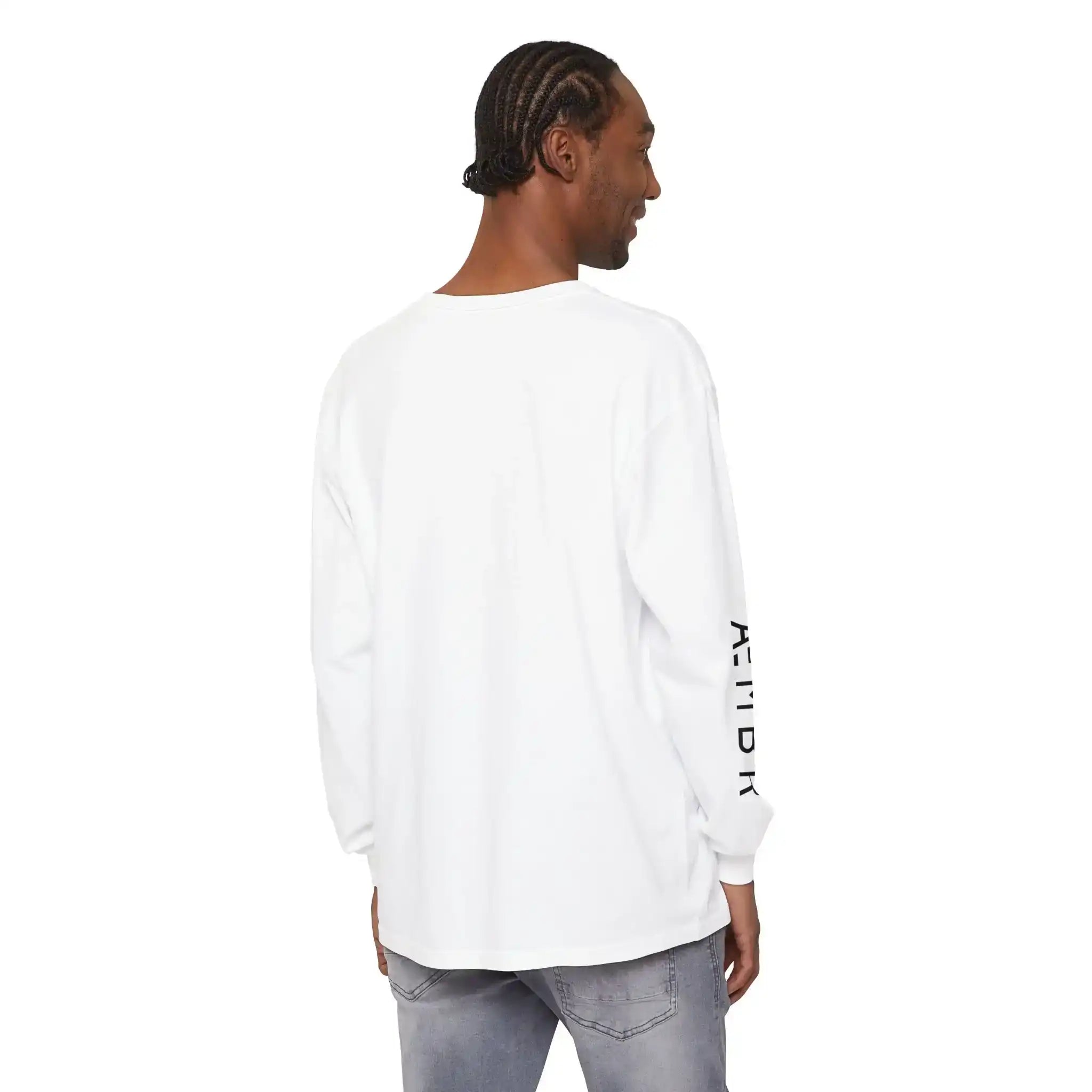 Man wearing white AEMBR long sleeve shirt with black logo on sleeve, light jeans, back view