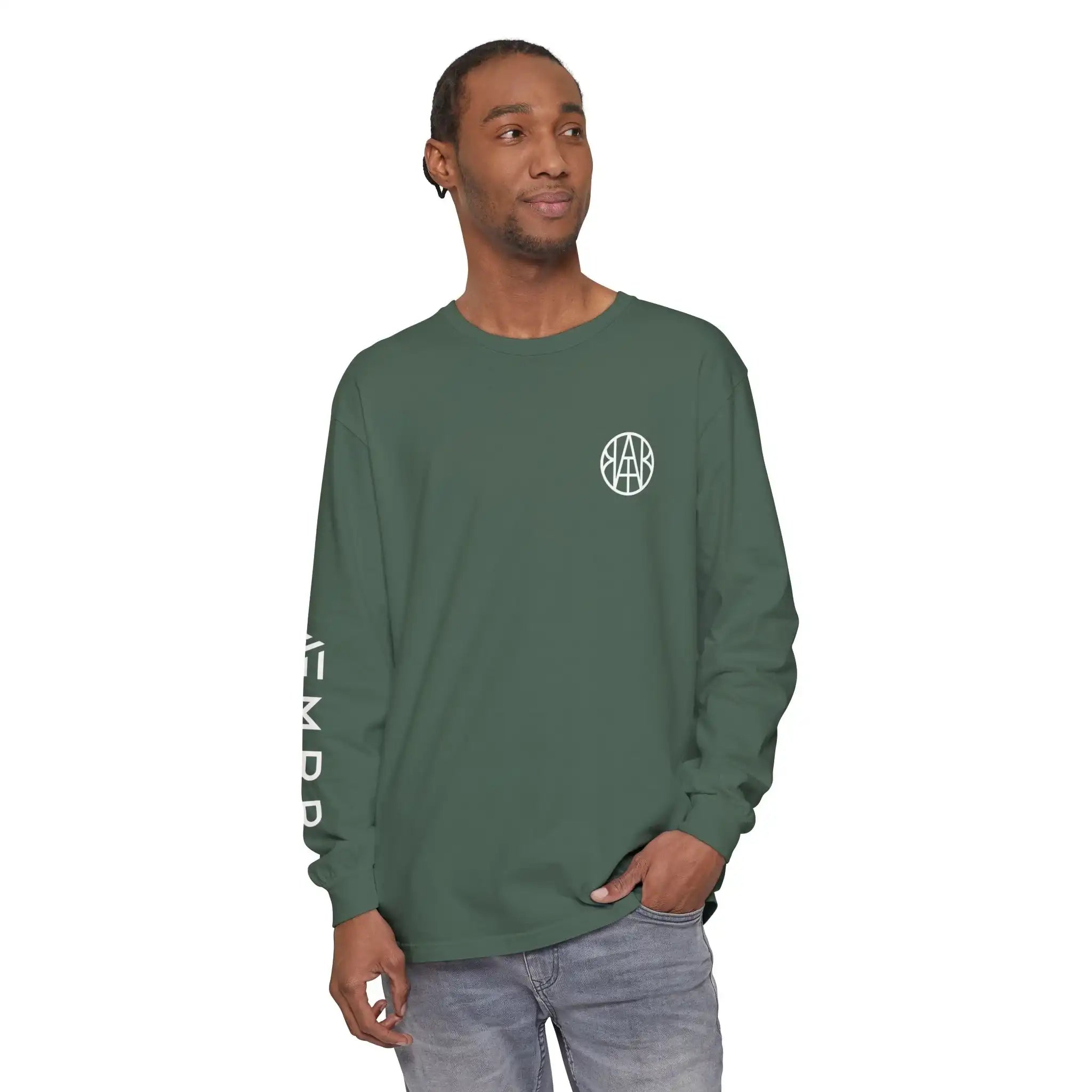 Man wearing AEMBR green long sleeve shirt with logo on chest and branding on sleeve