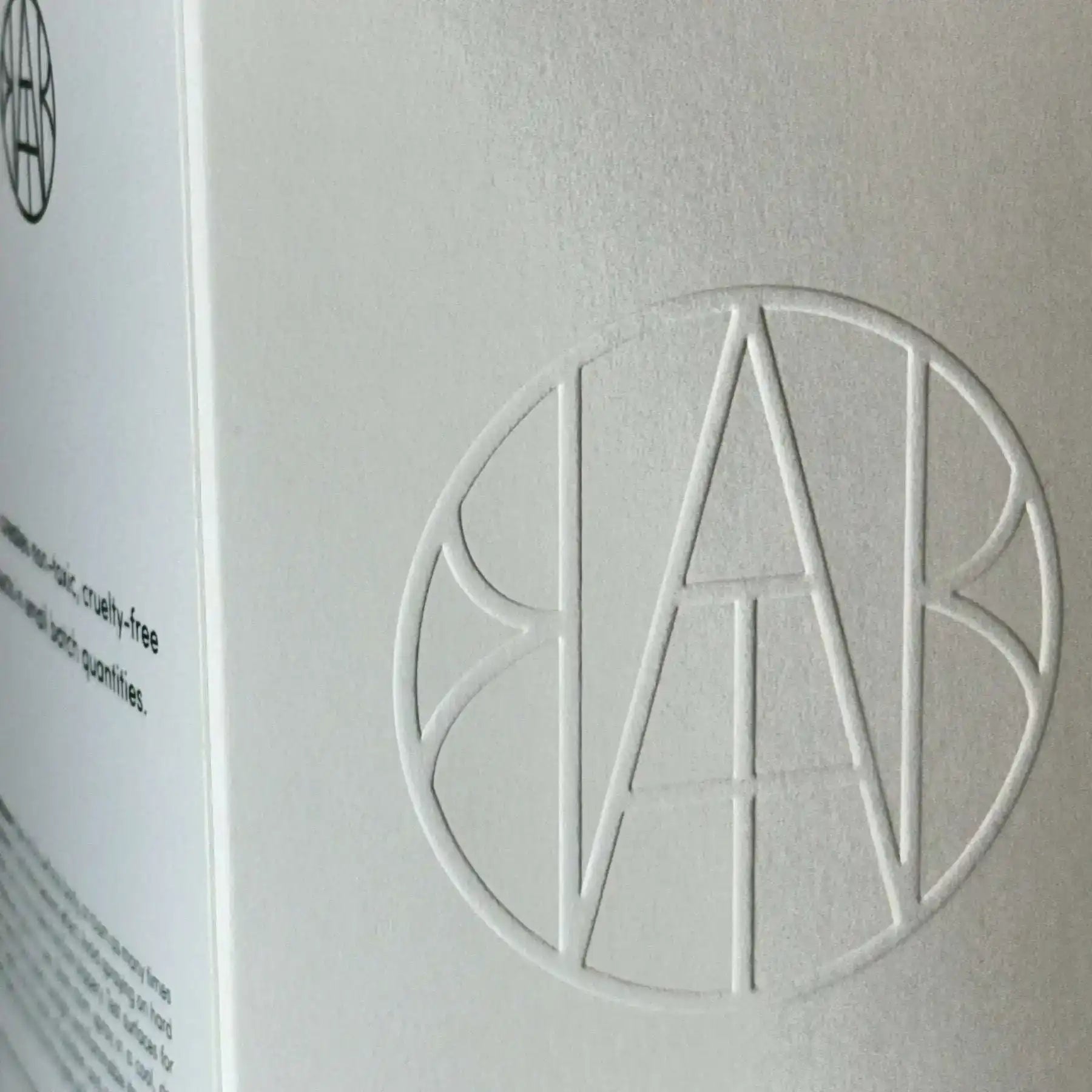 Embossed logo on white non-toxic product packaging, eco-friendly home essentials