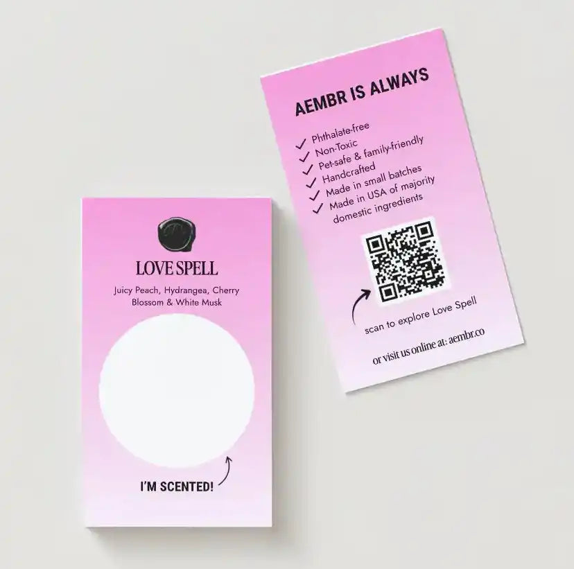 AEMBR Love Spell scent sample cards with peach, hydrangea, cherry blossom, and QR code.