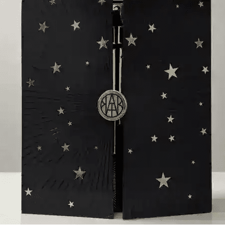 Luxury AEMBR Advent Calendar 2025 with festive designs, featuring numbered doors for daily holiday surprises.