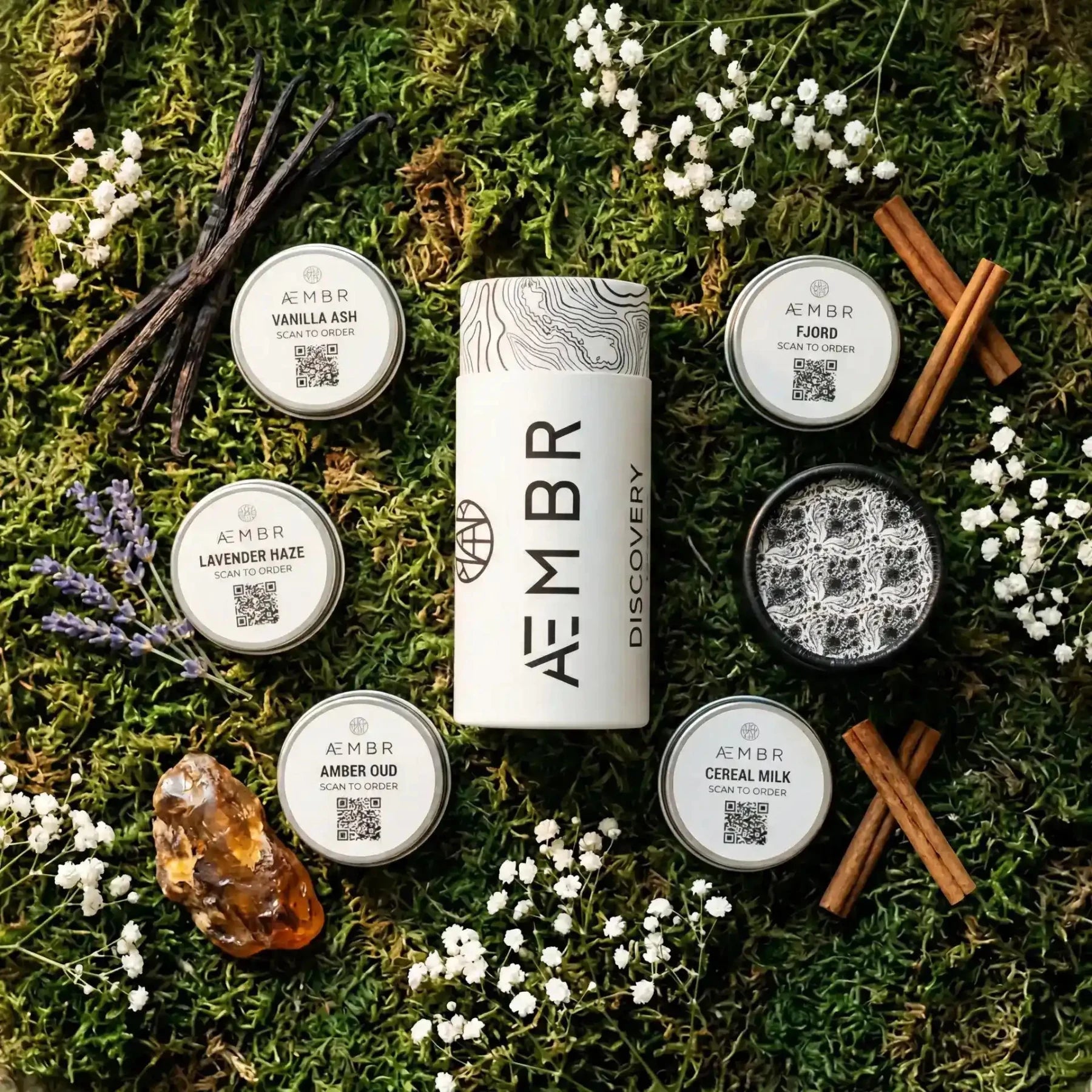 AEMBR Discovery Set of candles with multiple small candles in glass holders, showcasing the stylish and elegant AEMBR candle collection.