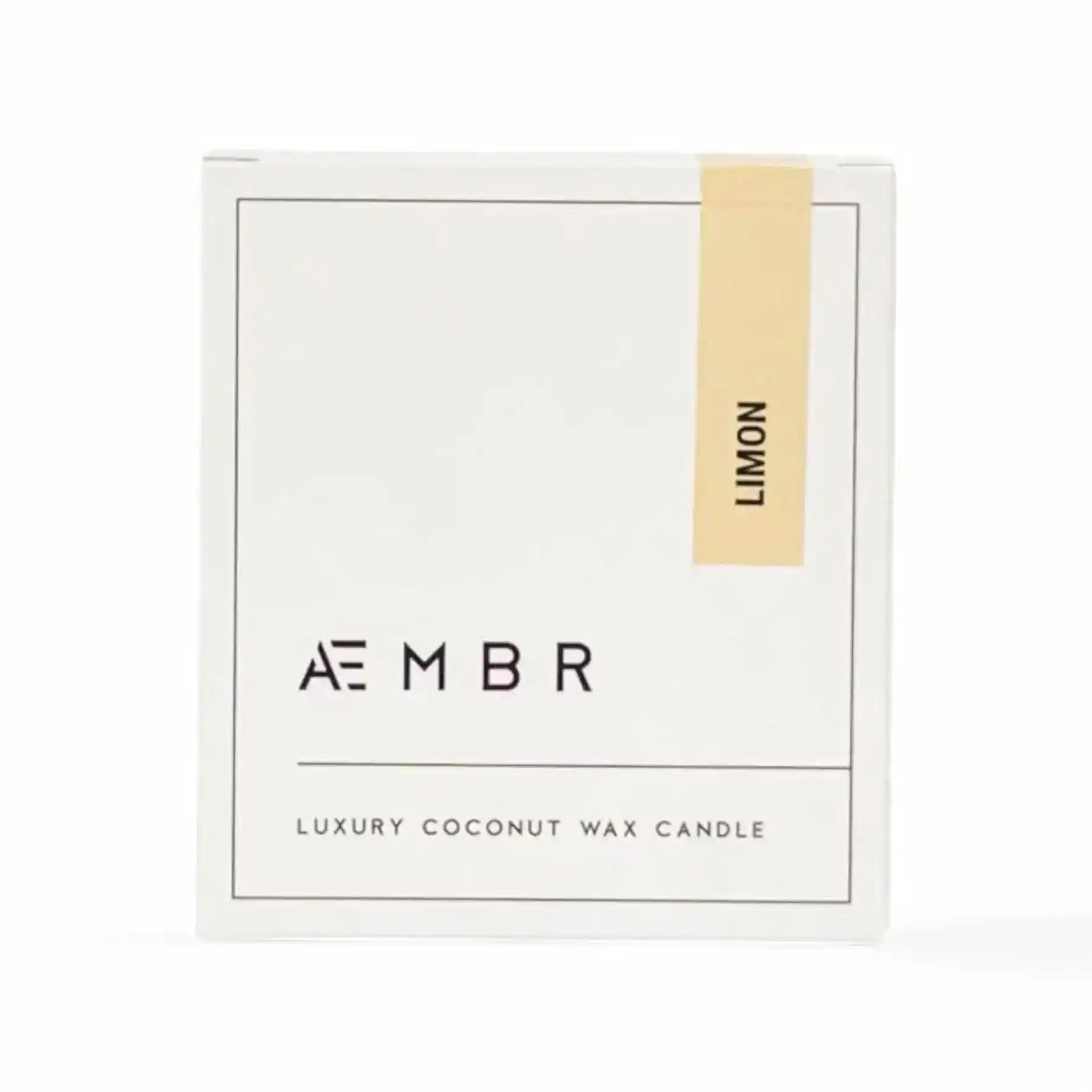 AEMBR Limon Candle with a sleek glass jar, bright yellow color, and fresh lemon scent for home decor and ambiance.