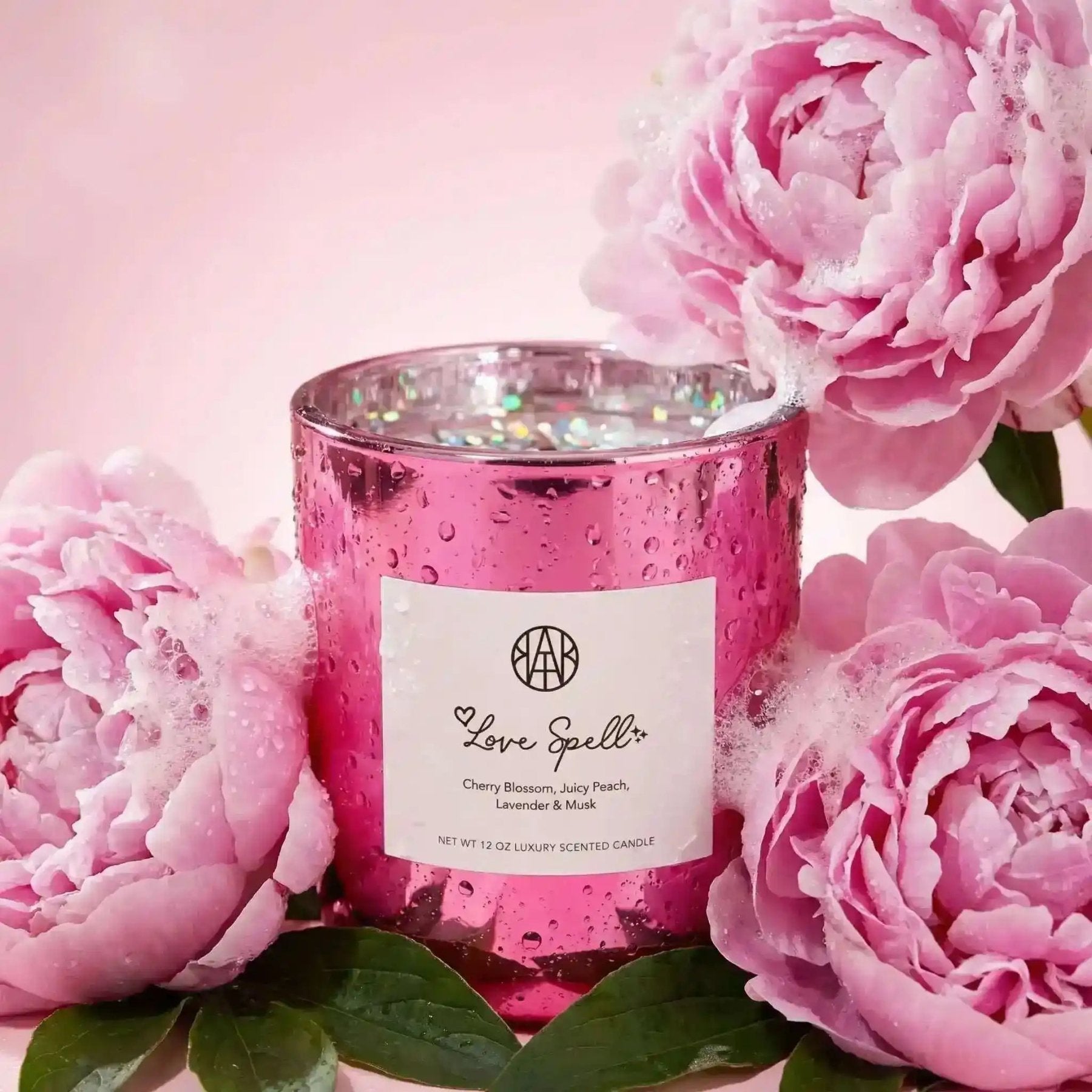 AEMBR Love Spell Candle with a sleek glass container and decorative label, perfect for romantic ambiance and aromatic use.