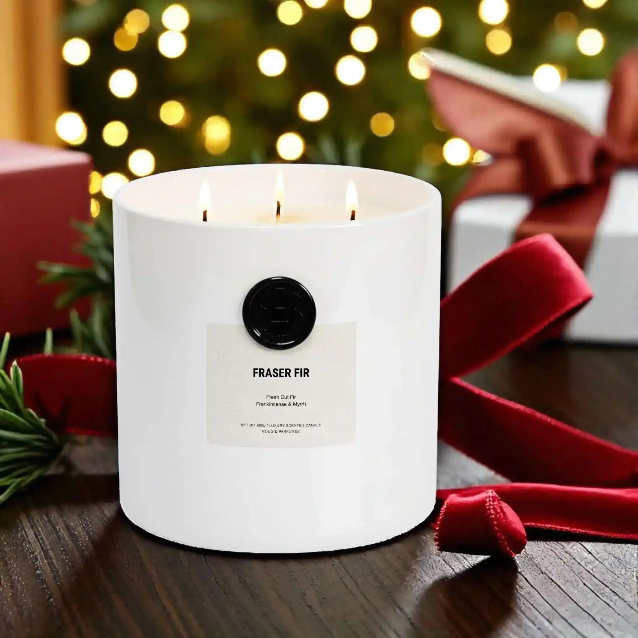 AEMBR Christmas Tree Bundle with Fraser Fir Alkymist and Viking Candle, featuring festive candle designs in a cozy setting.
