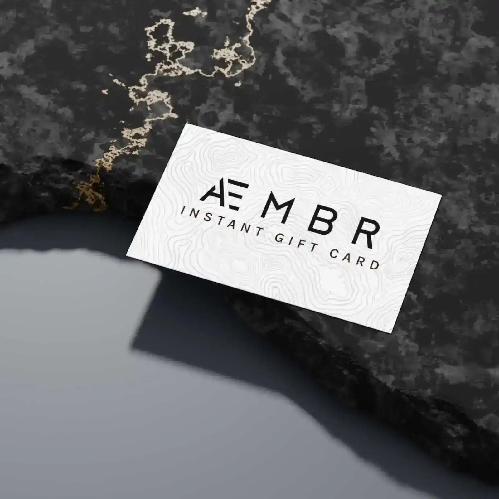 AEMBR E-Gift Card displaying a $25 value, featuring the AEMBR brand logo and a sleek, modern design on a white background.