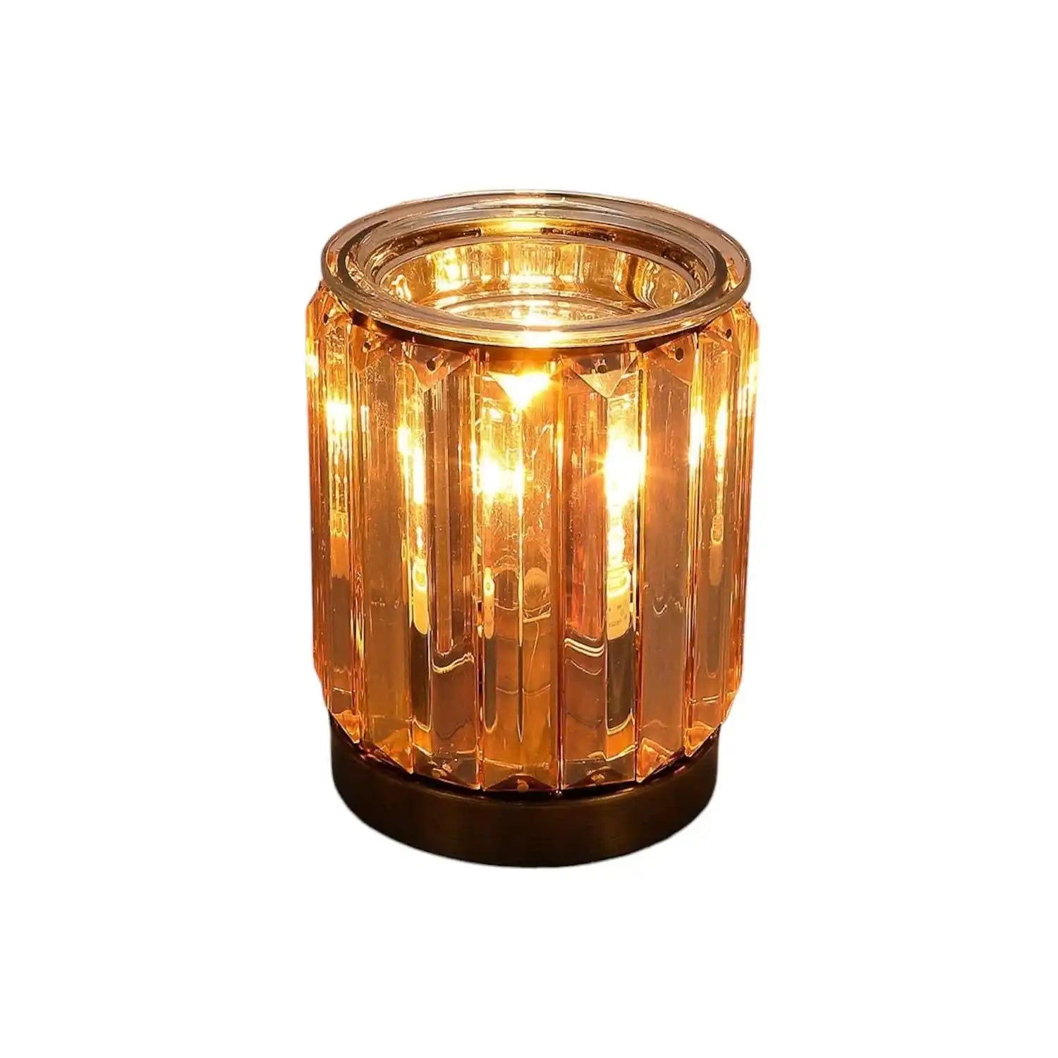 AEMBR golden glass deco candle glowing with warm light, luxury home decor centerpiece