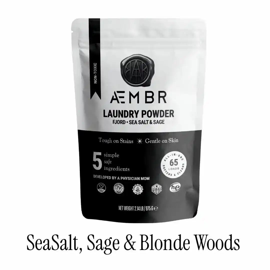 AEMBR luxury laundry gift set including detergent and fabric softener bottles in sea salt, sage, blonde woods scents.