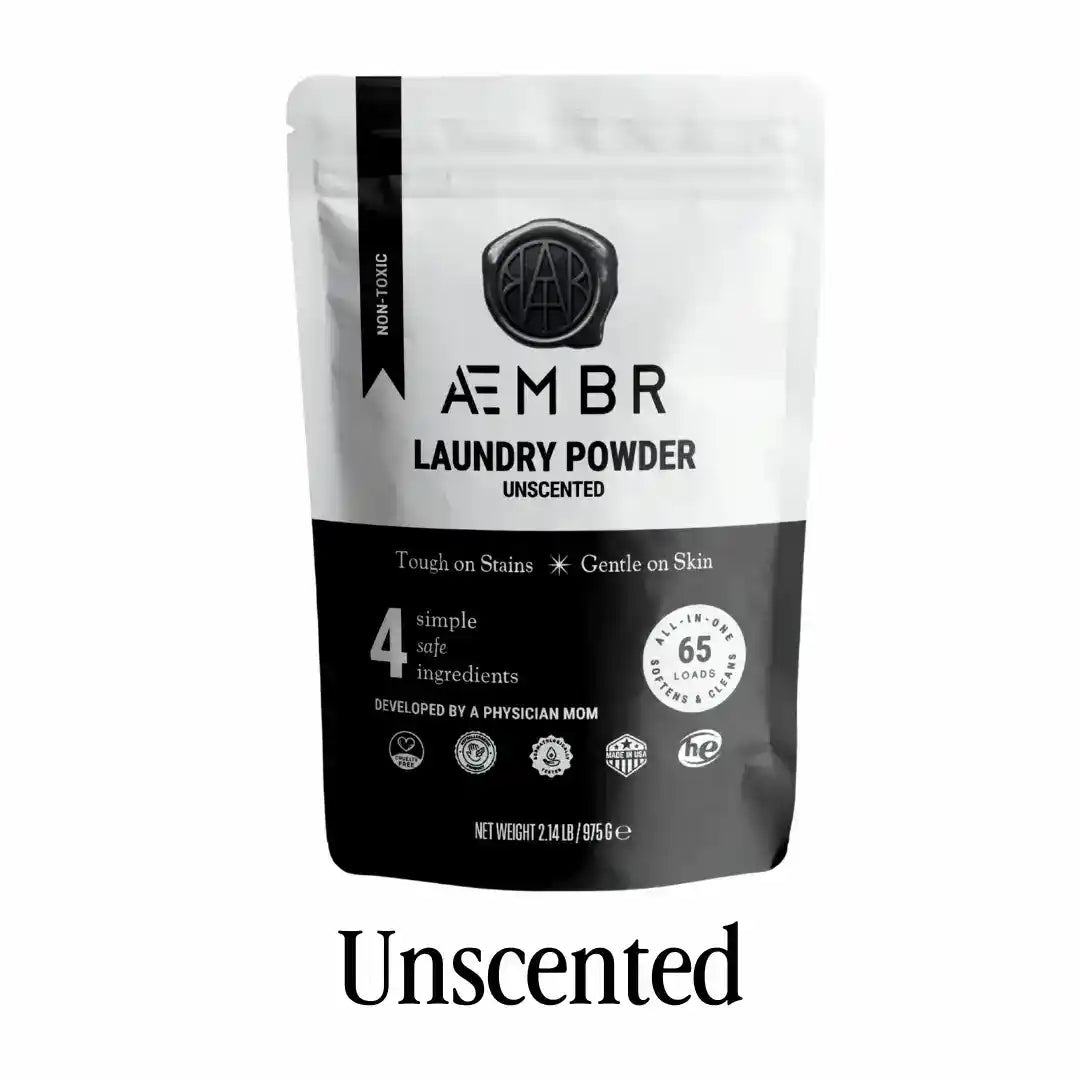 AEMBR laundry detergent powder in Fjord Sea Salt scent, featuring natural ingredients, in a white bag with blue and green accents.