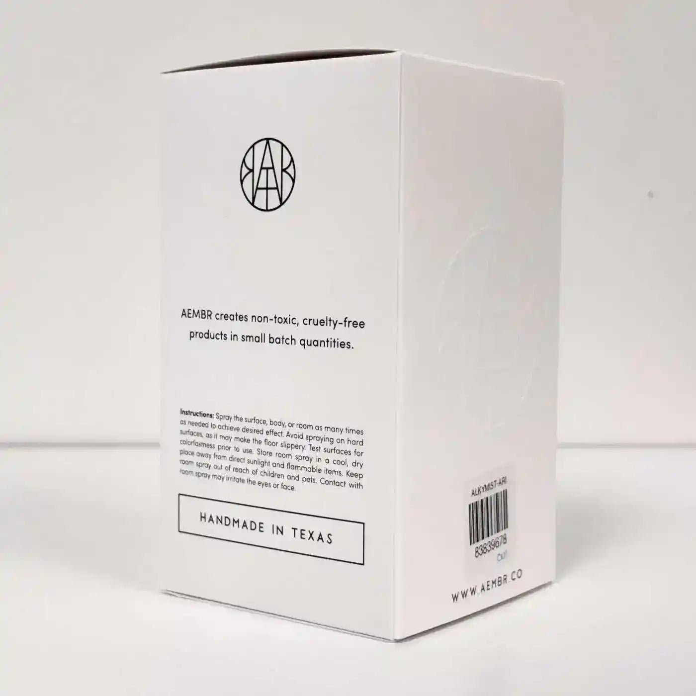 AEMBR ALKYMIST® Luxe Aristocrat multi-use fragrance bottle with elegant design and gold accents.