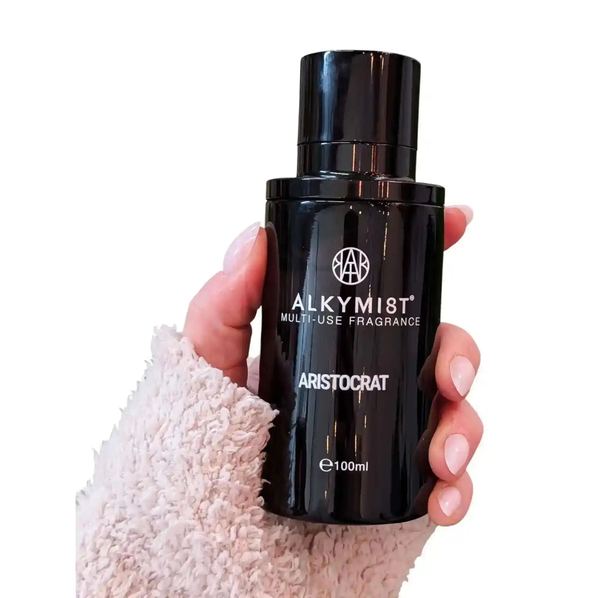 AEMBR ALKYMIST® Luxe Aristocrat multi-use fragrance bottle with elegant packaging and a sleek design.