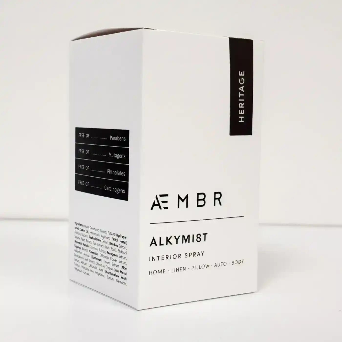 AEMBR ALKYMIST® Luxe Heritage multi-use fragrance bottle with elegant label and cap, set against a neutral background.