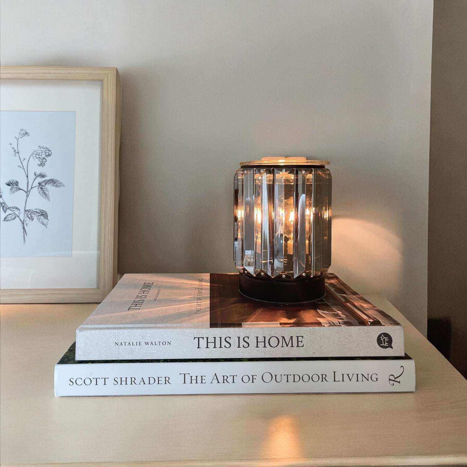 AEMBR Deco Wax Warmer displaying a stylish ceramic design with a lit tealight inside, perfect for home fragrance.