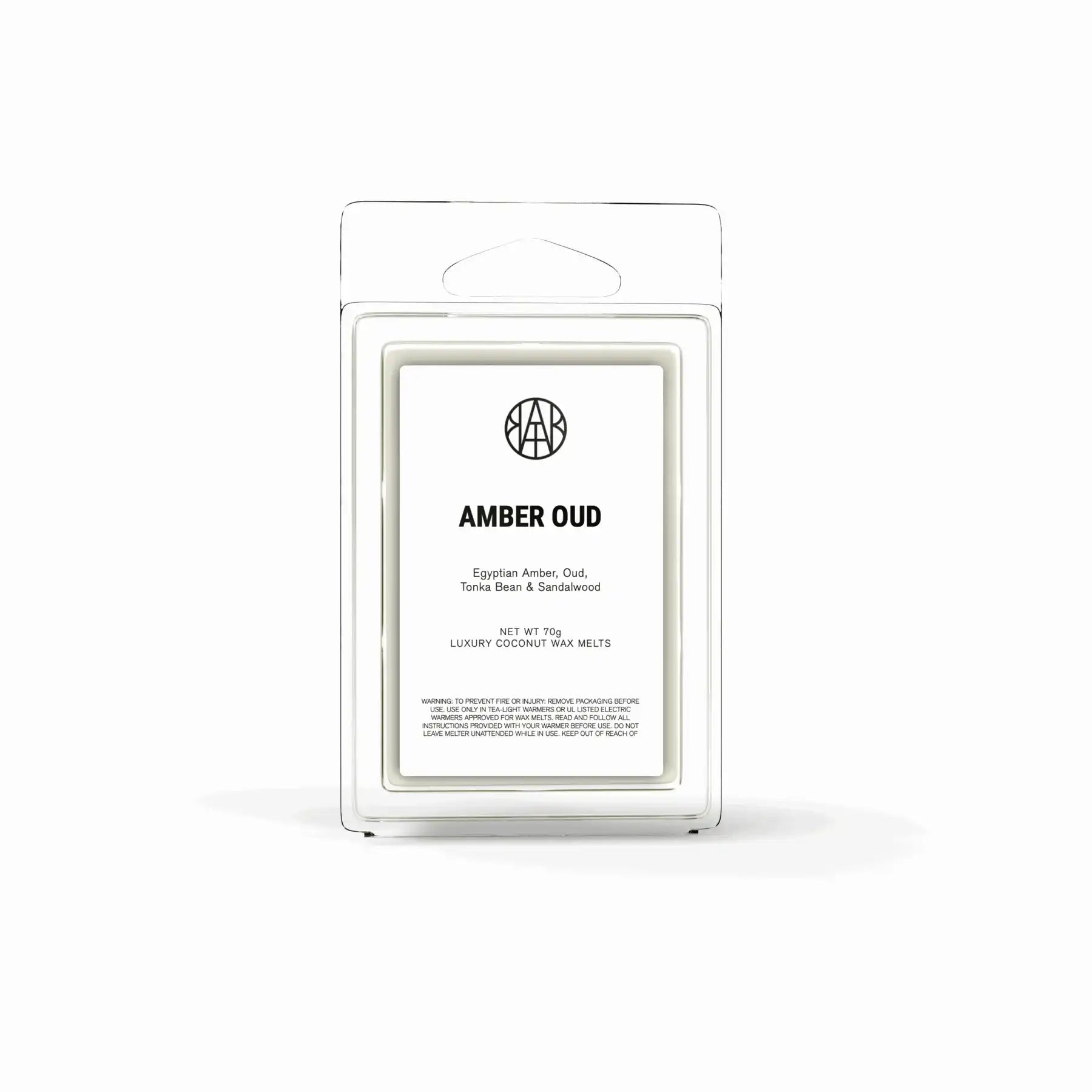 AEMBR Amber Oud luxury coconut wax melts in clear clamshell packaging, front label visible
