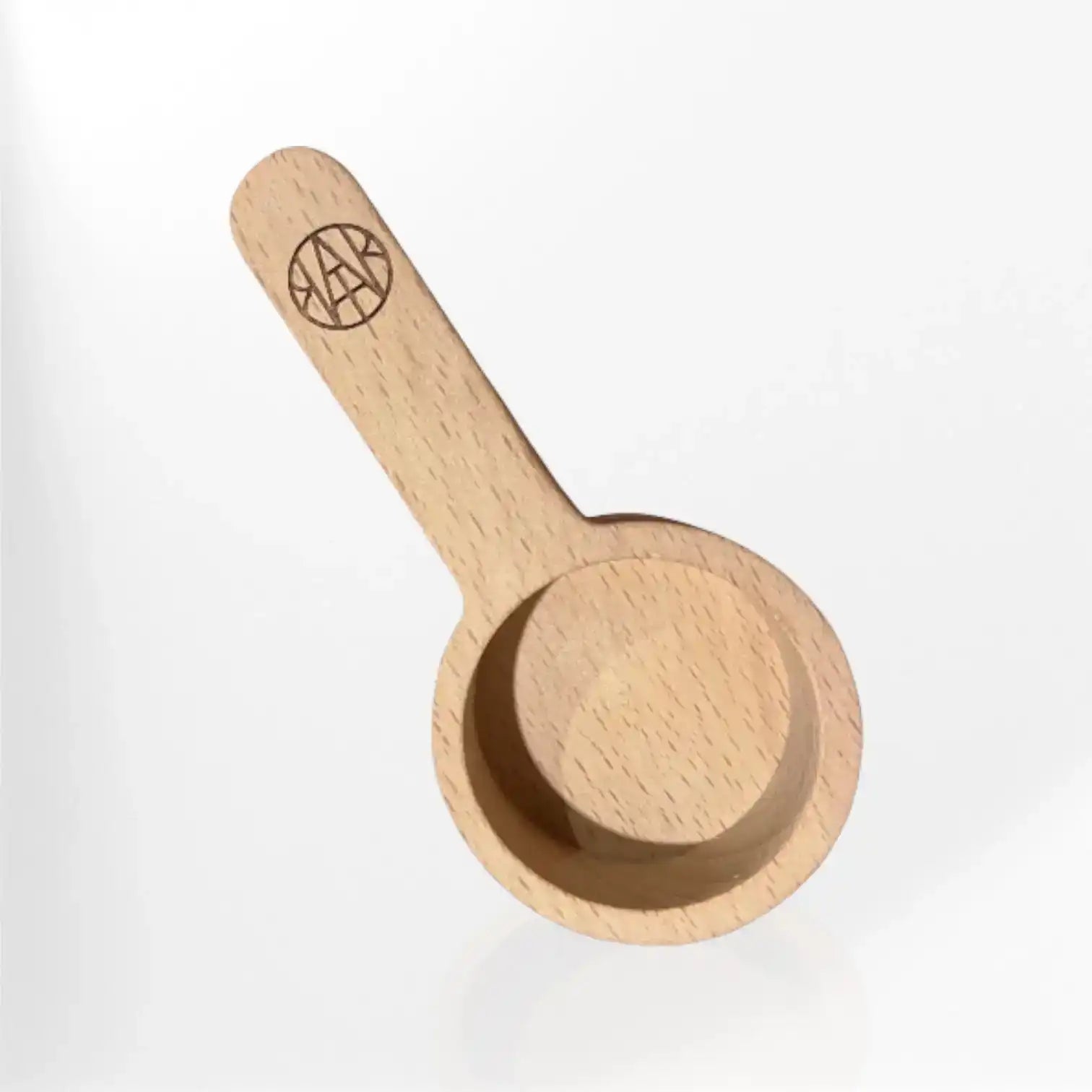 AEMBR custom wooden scoop with engraved logo on handle, minimalist background