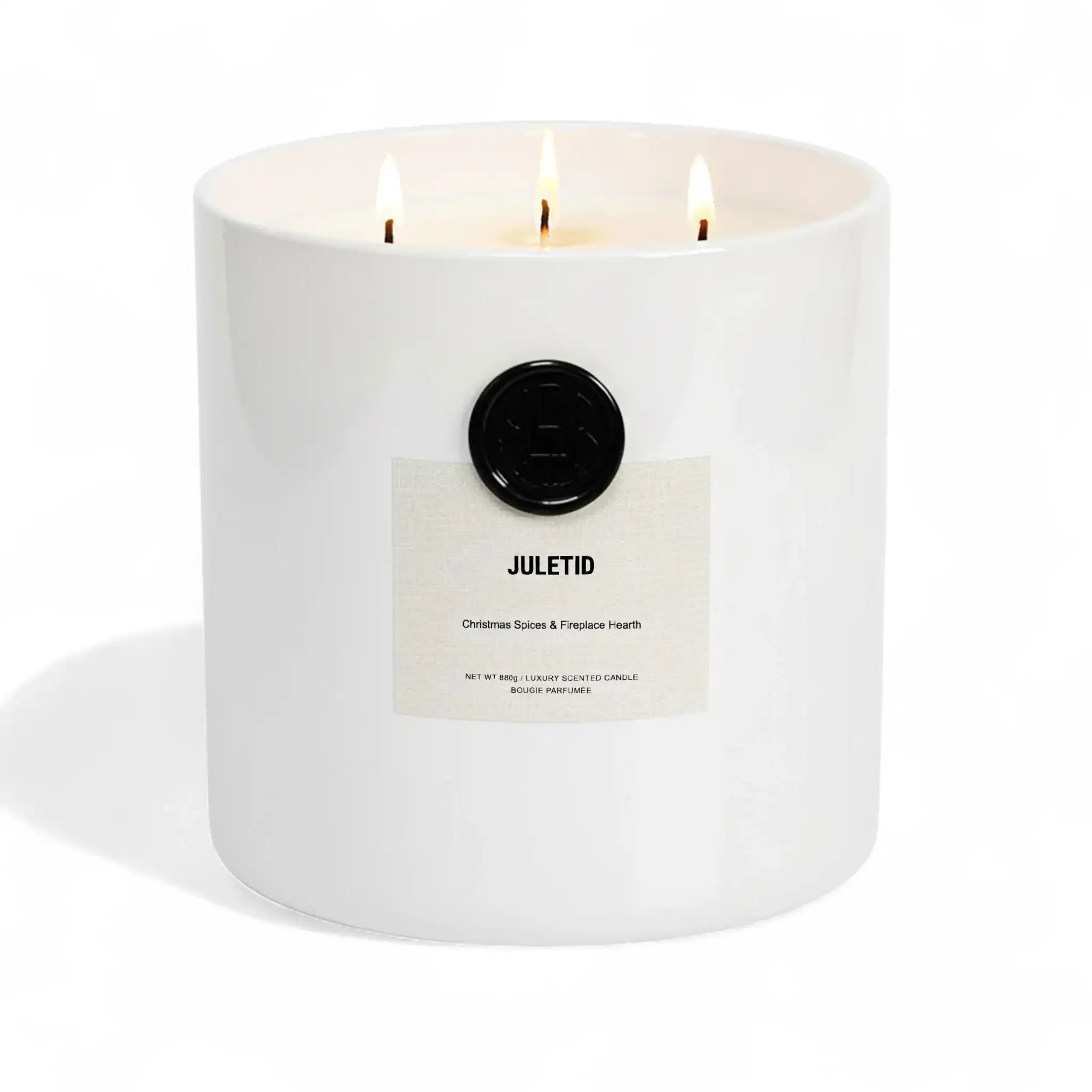 AEMBR Juletid luxury scented candle with three flames in a white jar, Christmas spices aroma.