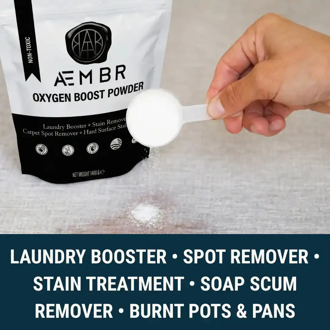 Non-toxic oxygen boost laundry detergent powder being scooped for stain removal