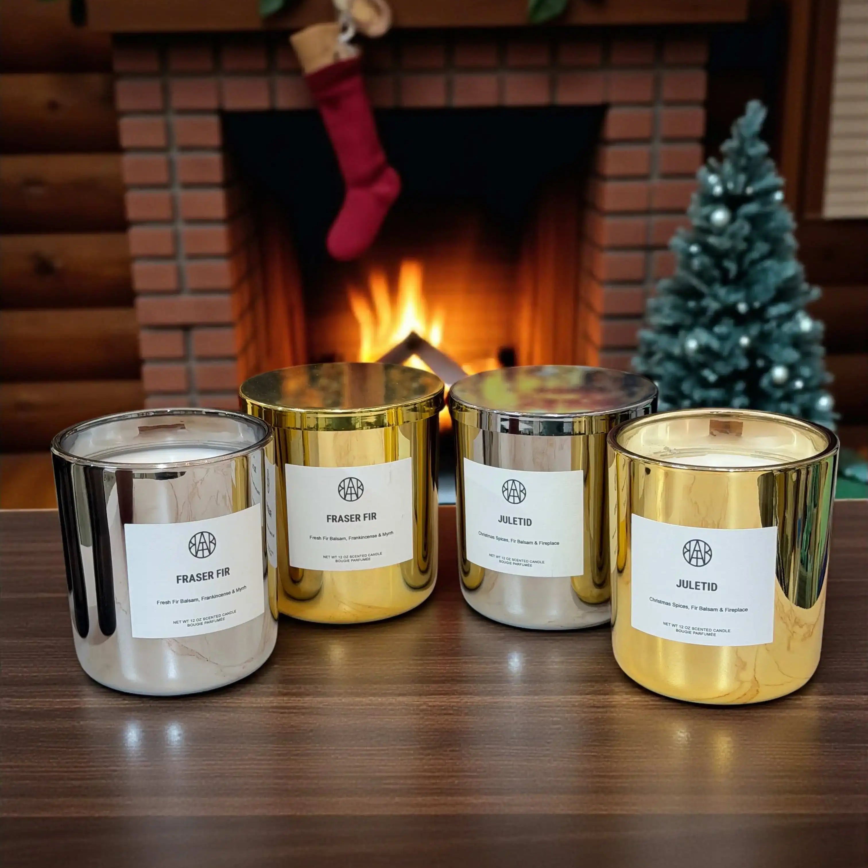 AEMBR silver and gold holiday candles on table with Christmas tree and fireplace in background