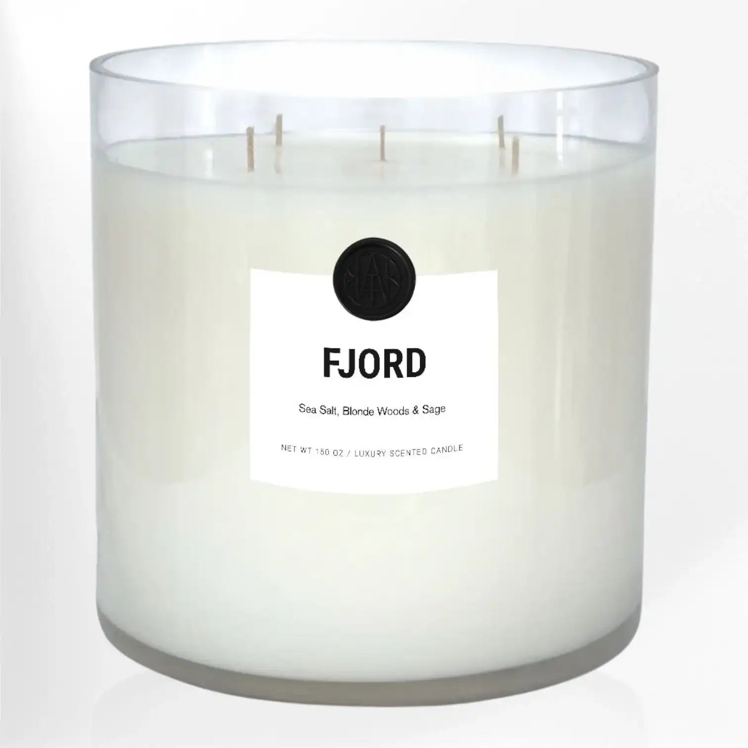 FJORD non-toxic luxury scented candle with sea salt, blonde woods and sage in clear glass.
