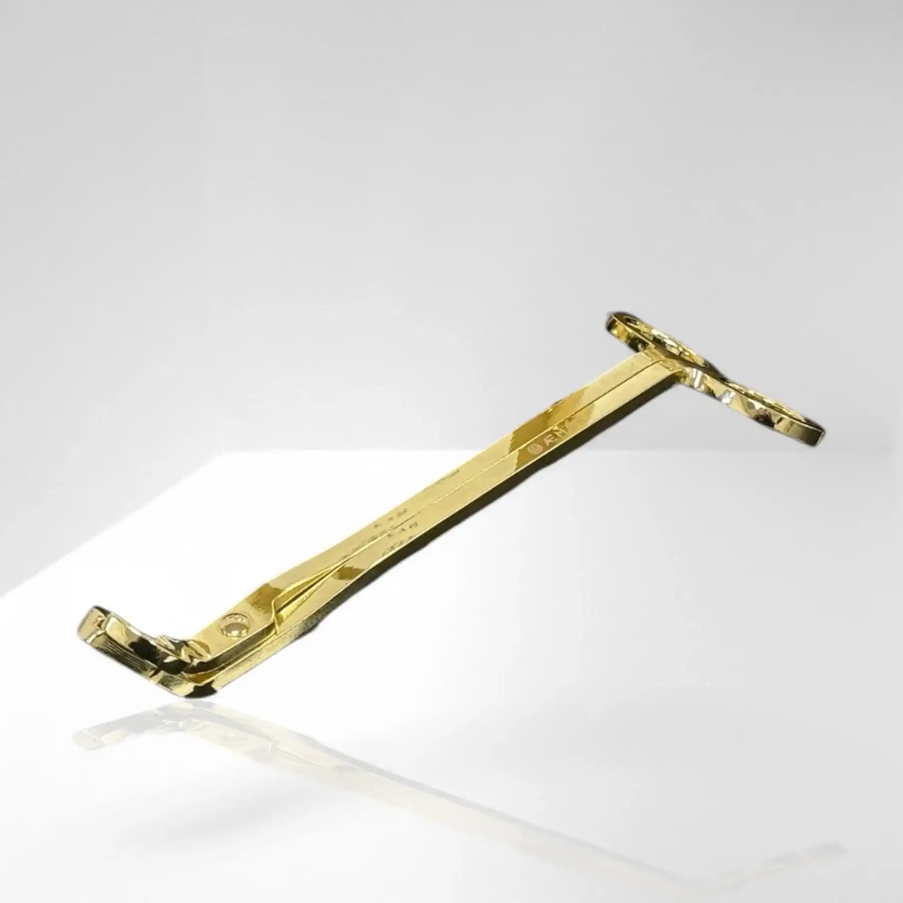 AEMBR gold wick trimmer for candles on a reflective white background