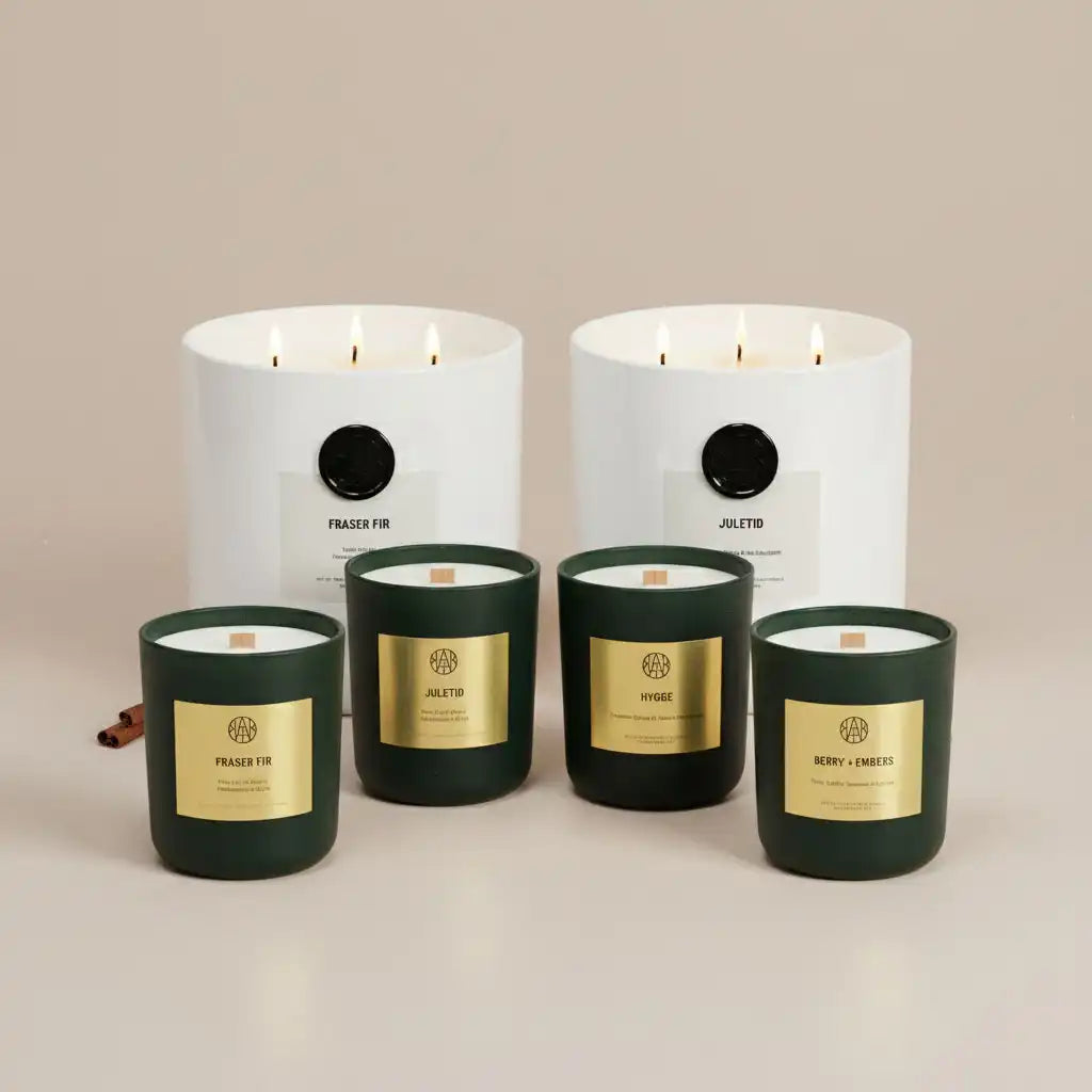 AEMBR winter beige candles in green and white glass jars on neutral background.