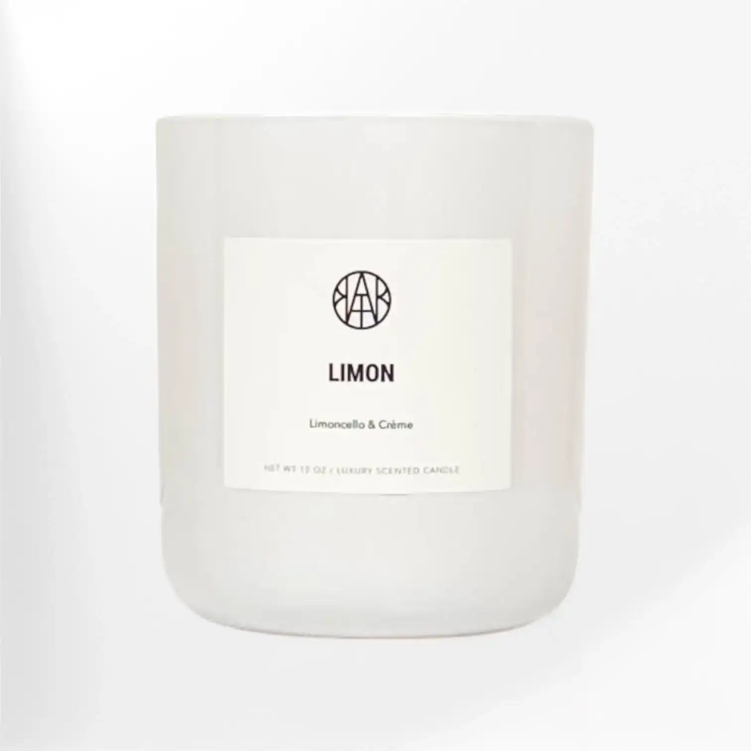 AEMBR Limon non-toxic scented candle in sleek white glass jar, minimalist label, home fragrance