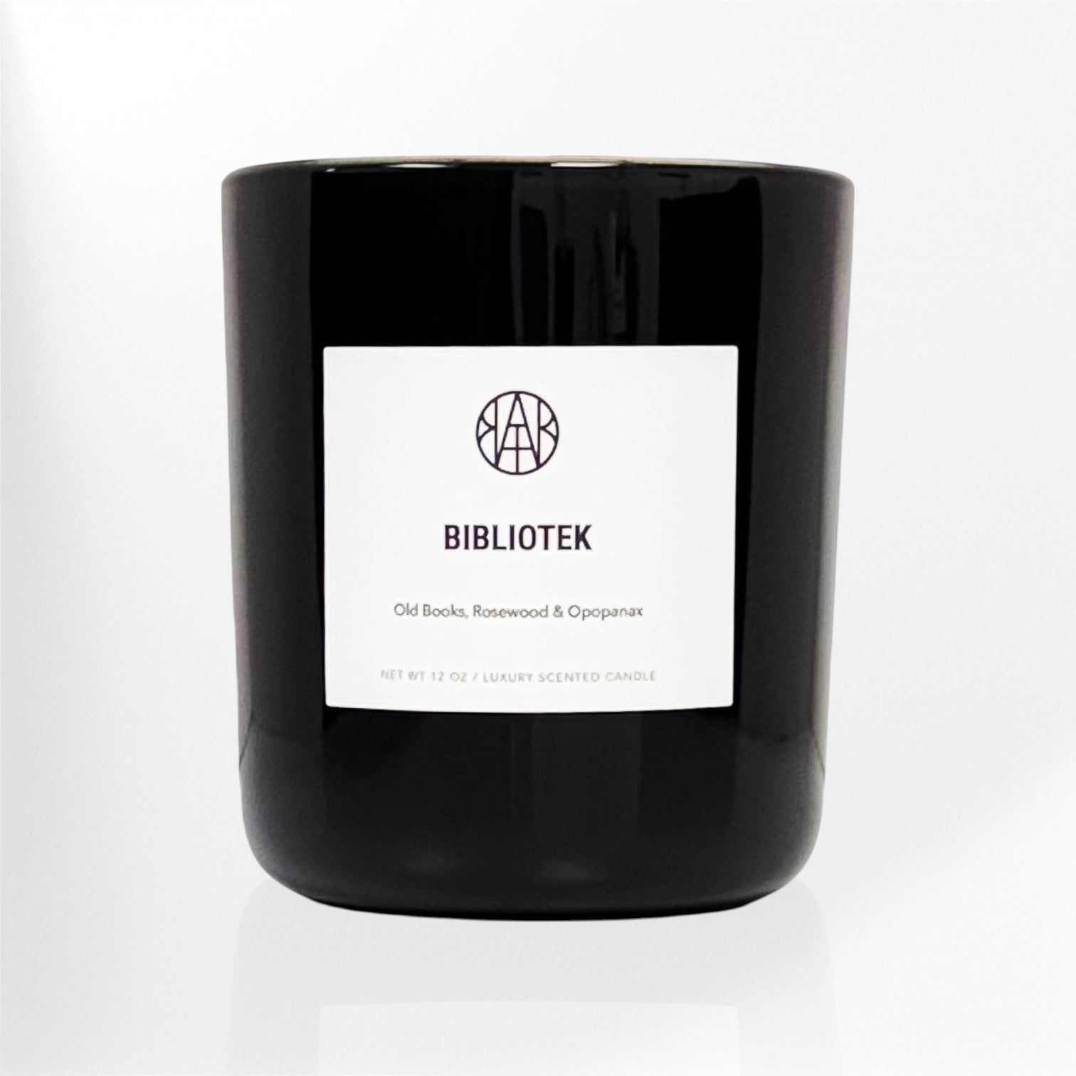 AEMBR black jar candle labeled BIBLIOTEK, luxury non-toxic home scent by Dr. Kristina Braly