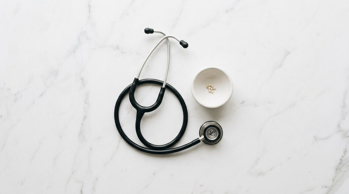 Stethoscope and ceramic bowl on marble — AEMBR physician-formulated cleaning products