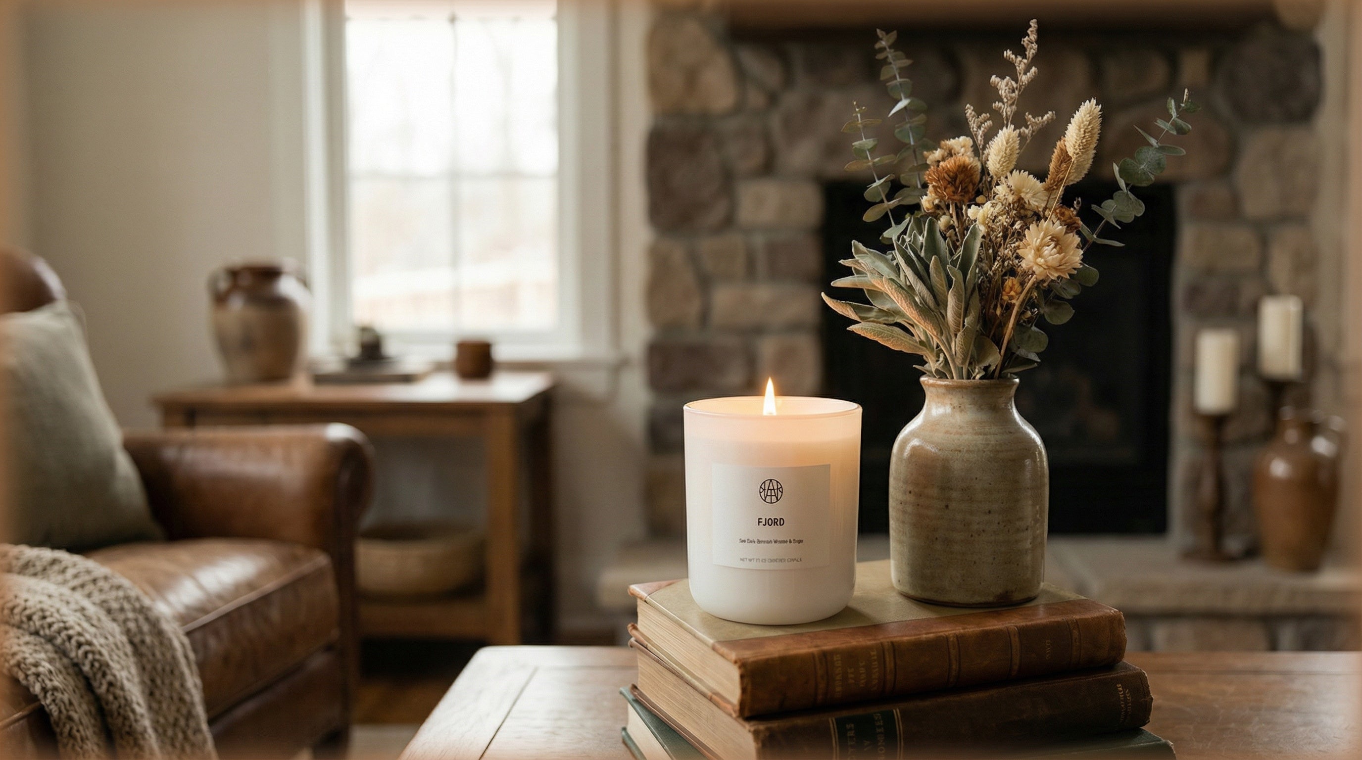 Cozy living room with white hydrangeas, non-toxic candle and box on coffee table, grey sofa.