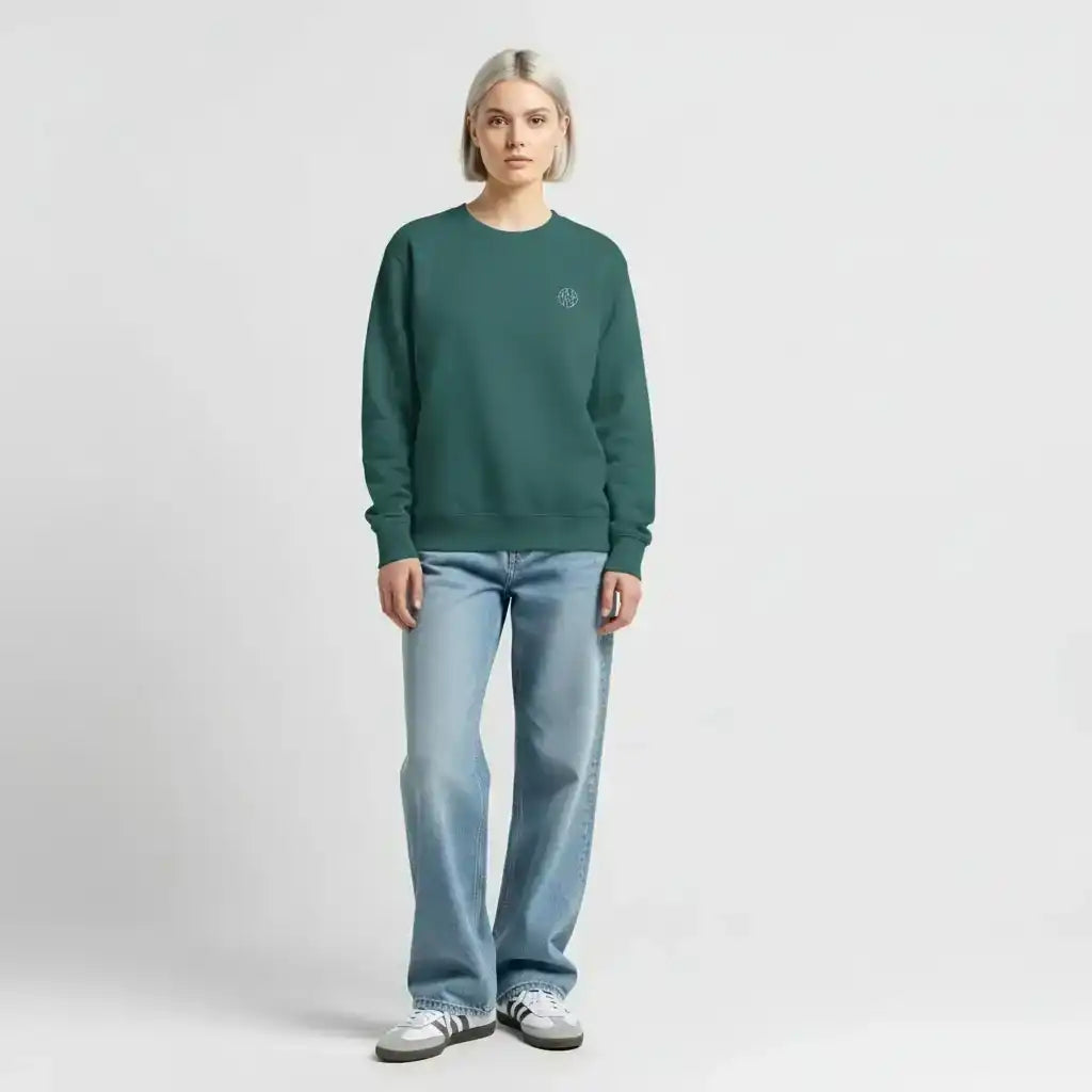 AEMBR green crewneck sweatshirt on woman, light wash jeans, minimal background