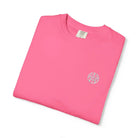 AEMBR pink cotton t-shirt with small white logo, folded on white background