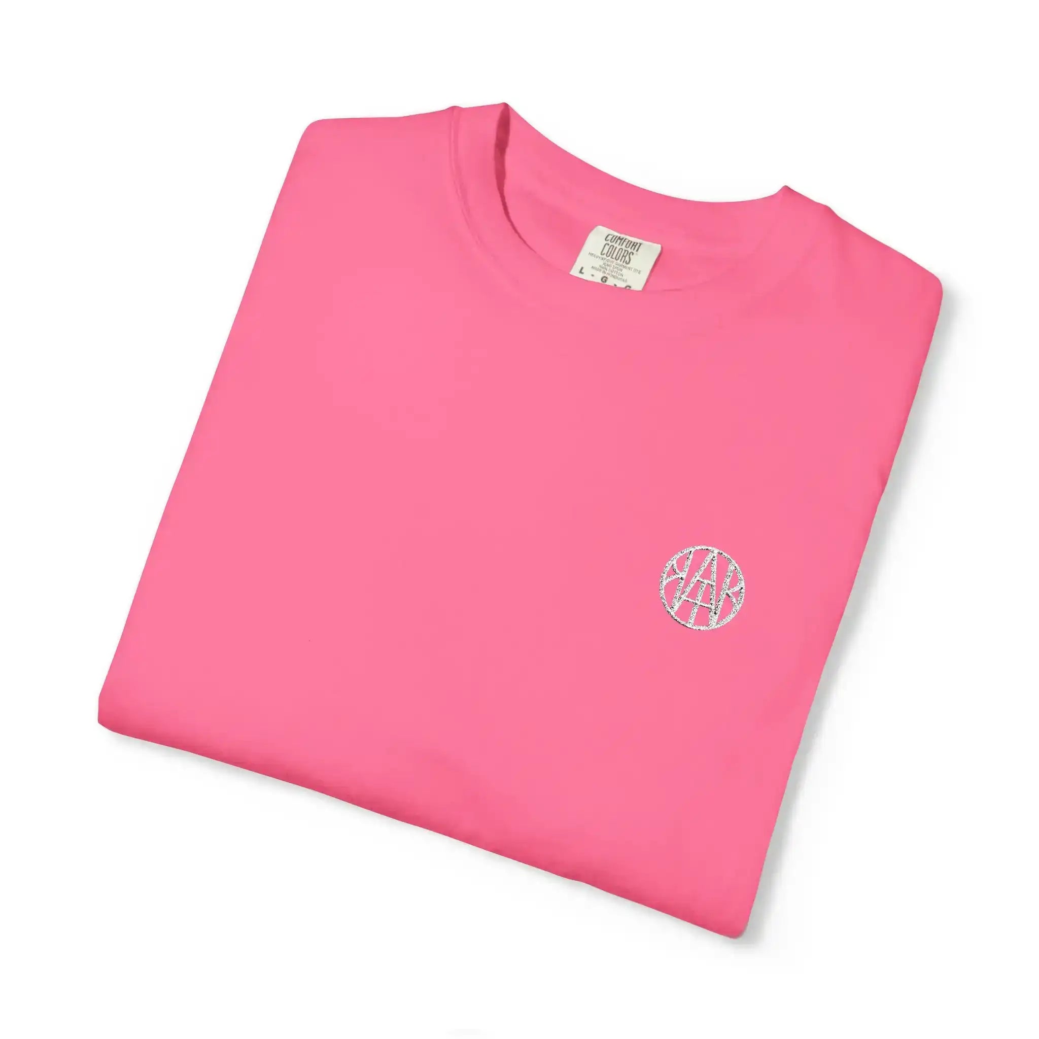 AEMBR pink cotton t-shirt with small white logo, folded on white background