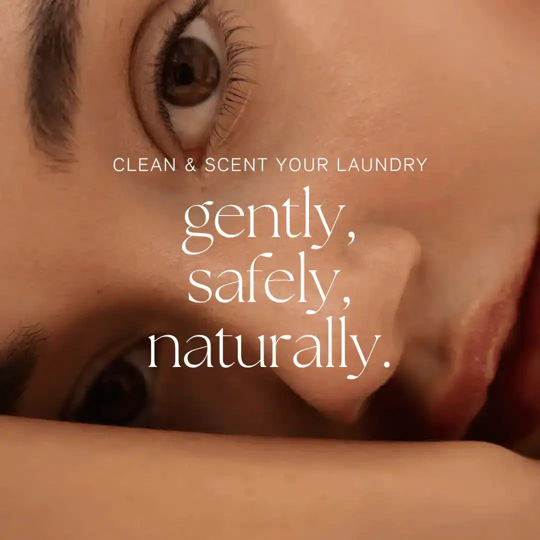 Closeup of a person's face with text promoting AEMBR non-toxic natural laundry care