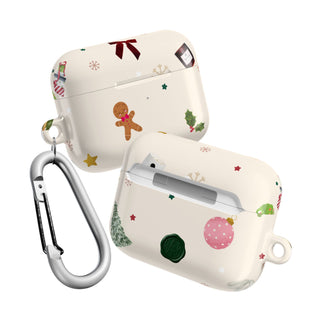 Two Christmas-themed airpod cases with decorative elements on a white background