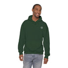 Man wearing green AEMBR hoodie with logo, casual fashion, white background