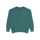 AEMBR teal crewneck sweatshirt with white minimalist logo on front, displayed on white background