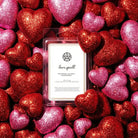 AEMBR Love Spell wax melts with glittery red and pink hearts background, luxury home fragrance