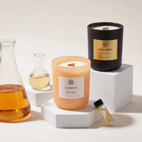 AEMBR Cloudberry Candle with a white wax finish and a natural cotton wick, perfect for cozy home ambiance.
