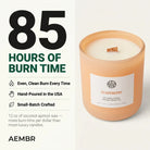 AEMBR Cloudberry Candle with a white ceramic holder and a lit flame, showcasing a cozy and elegant candle design.