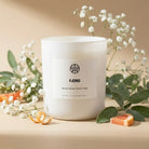 Non-toxic scented candle with sea salt, blonde woods, sage, flowers, and citrus accents