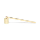 Gold non-toxic candle snuffer for safe candle extinguishing on white background