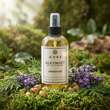 Non-toxic lavender multi-use fragrance spray bottle on moss with lavender flowers