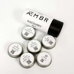 AEMBR Discovery Set with six non-toxic scented candle tins on a white background