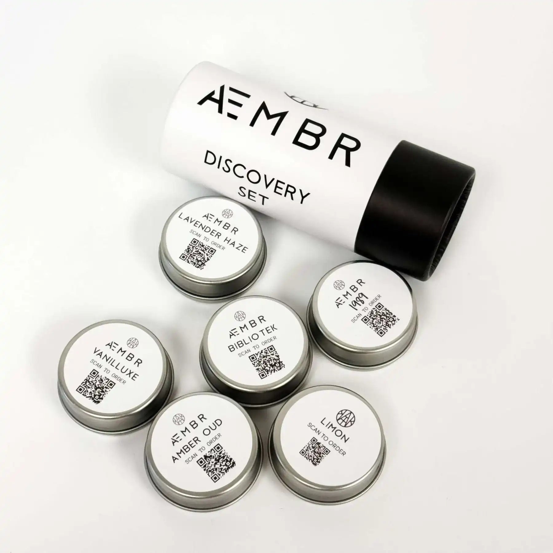 AEMBR Discovery Set sample candle tins with minimalist white and black packaging.