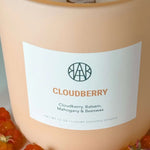 AEMBR Cloudberry non-toxic luxury scented candle with label and berries, clean home fragrance