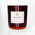 AEMBR Spiced Oatmilk scented candle in a brown glass jar with minimalist label