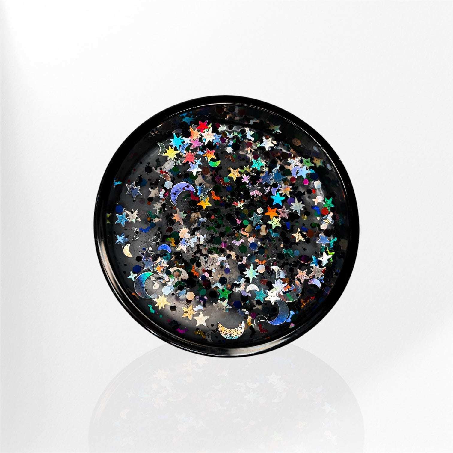 AEMBR decorative black dish with colorful star and moon confetti on white background