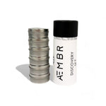 AEMBR Discovery Set with stacked metal tins and branded non-toxic home fragrance packaging
